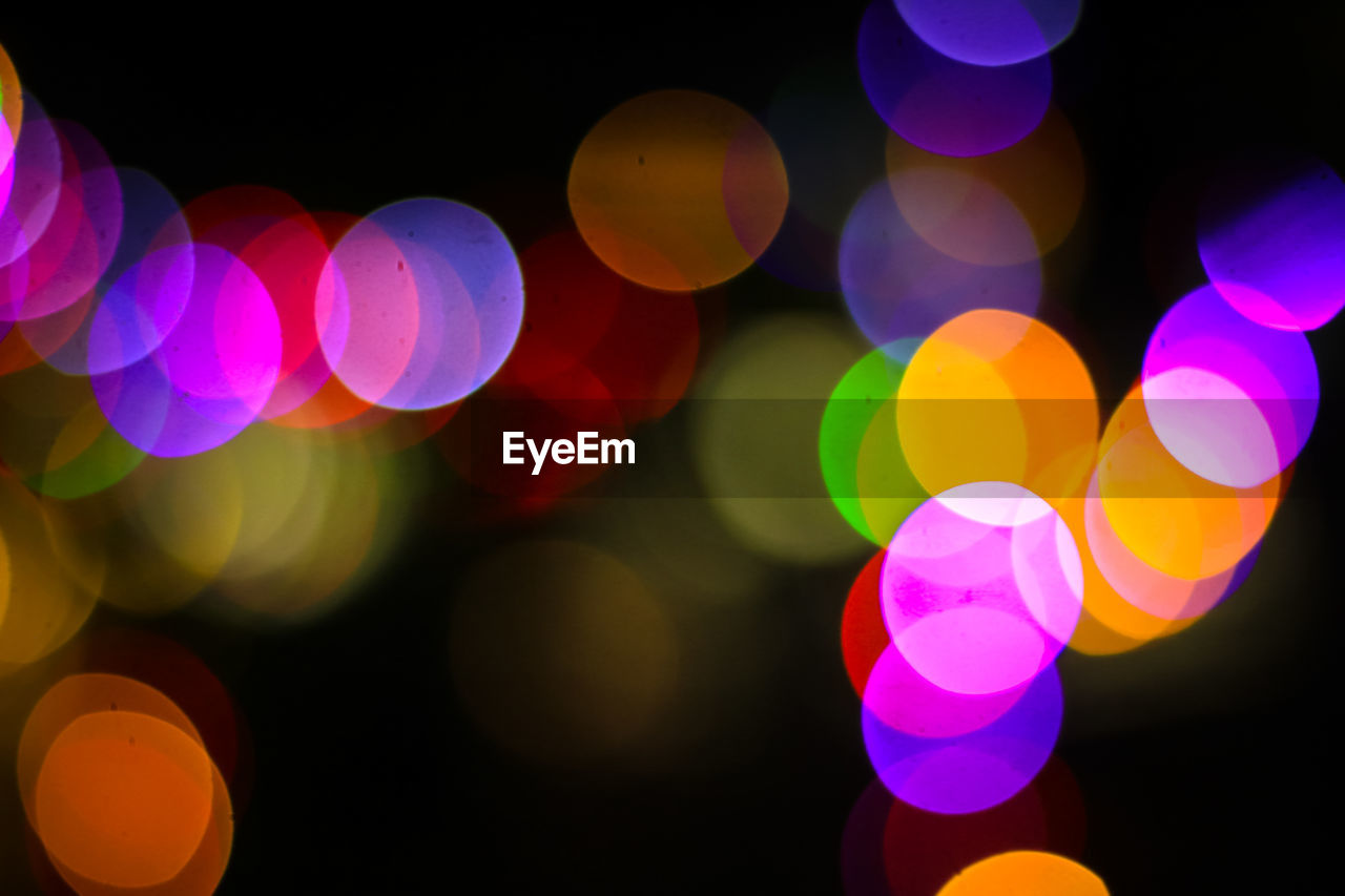 Defocused image of illuminated colorful lights