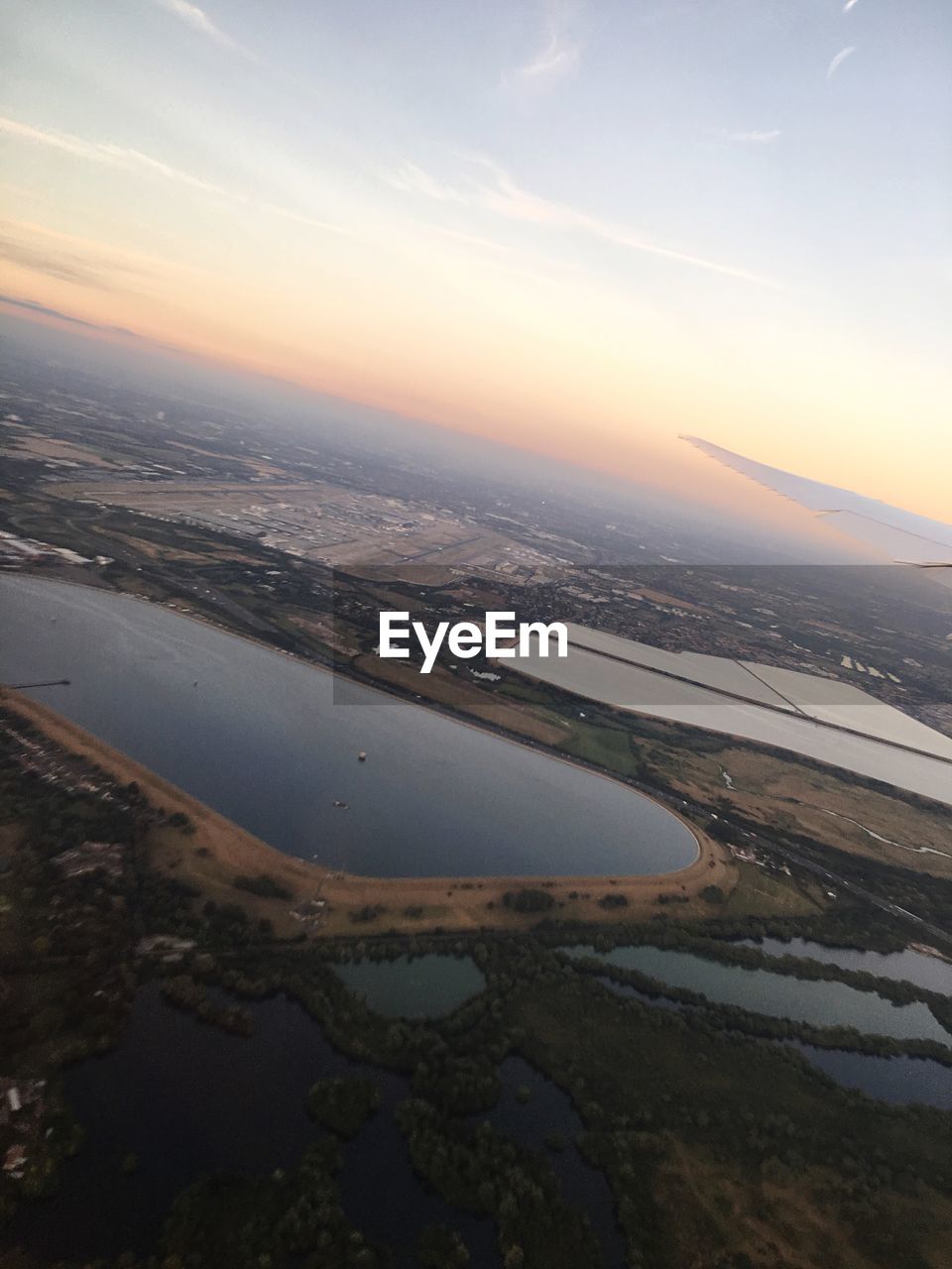 High angle view of city at sunset