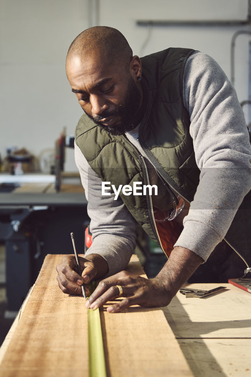 Carpenter working at workshop