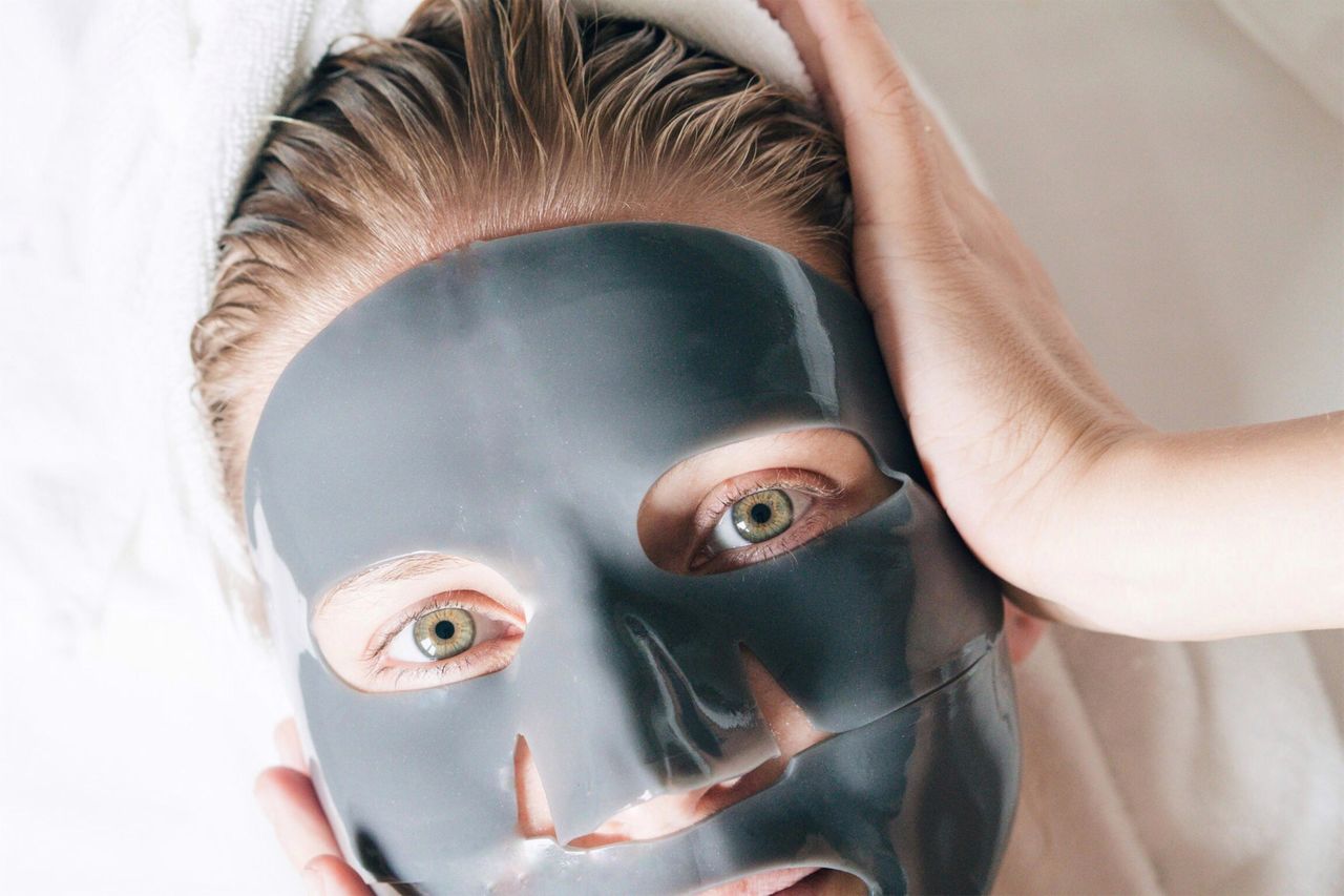 Close-up portrait of woman wearing facial mask