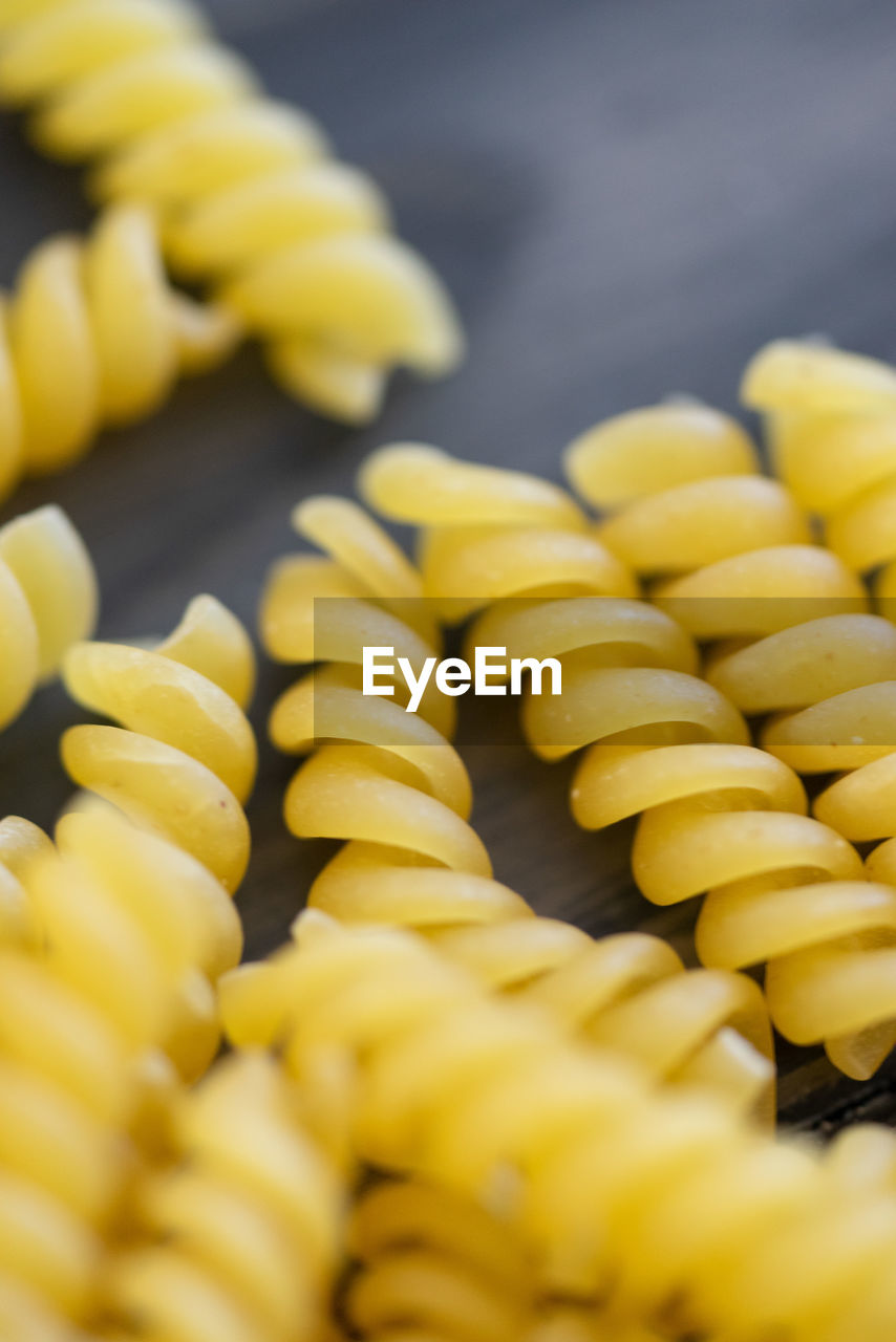 yellow, food, food and drink, freshness, dish, italian food, produce, close-up, large group of objects, no people, selective focus, healthy eating, vegetable, fusilli, raw food, wellbeing, corn kernels, pasta, cuisine, abundance, corn, indoors, in a row, still life