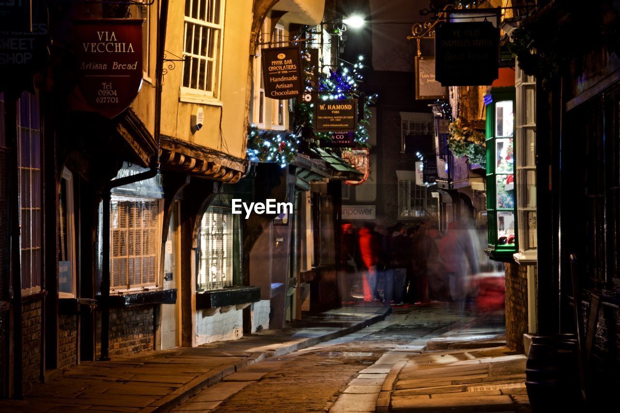 VIEW OF CITY STREET AT NIGHT