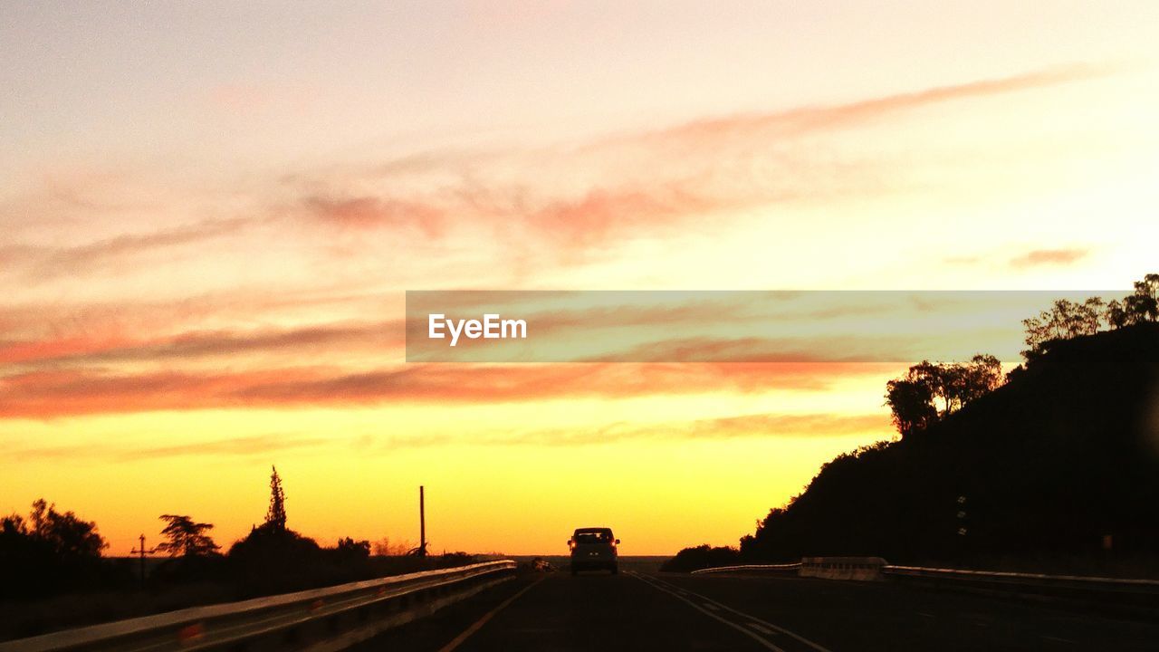 VIEW OF ROAD AT SUNSET