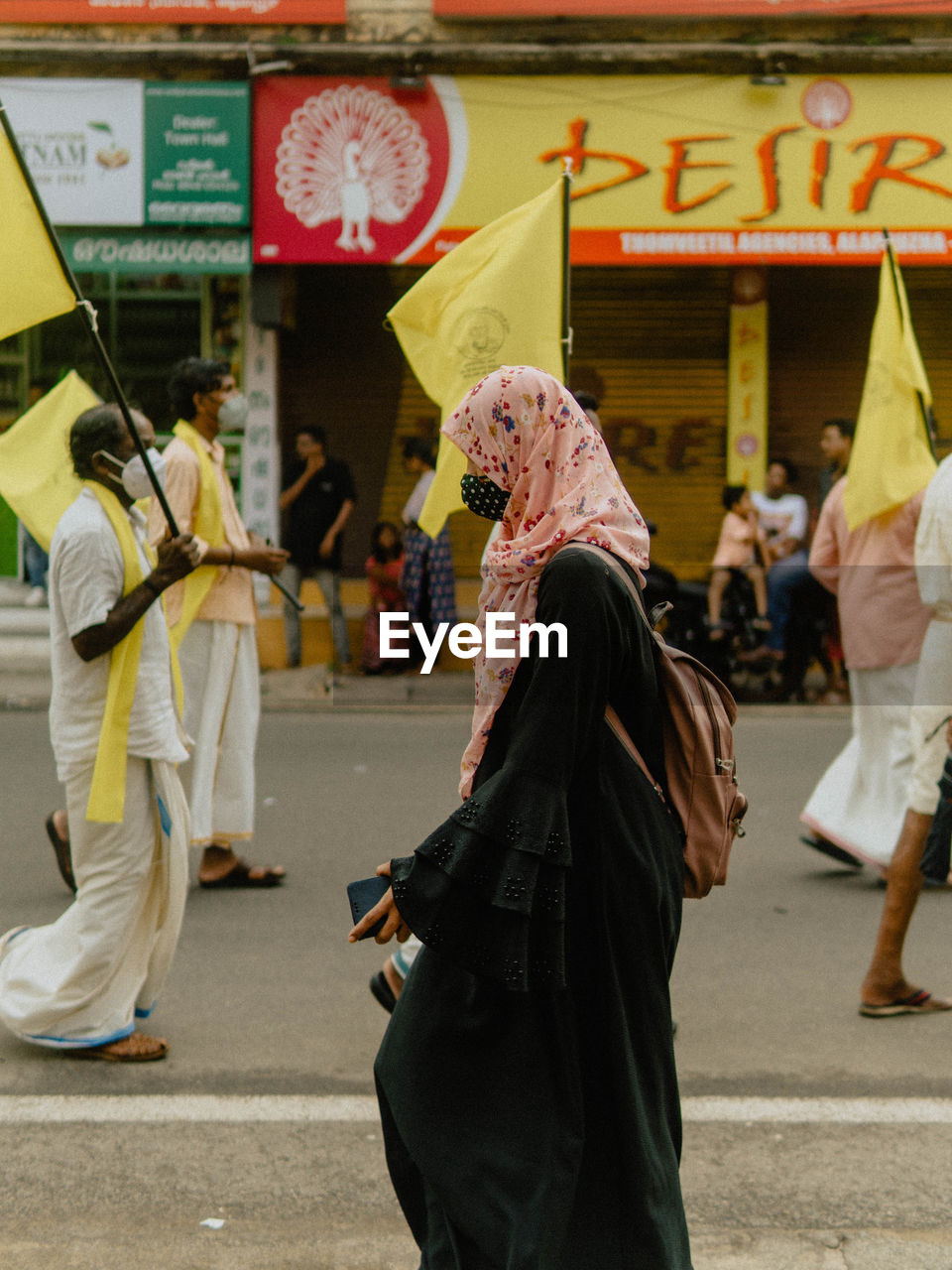 city, group of people, traditional clothing, street, tradition, architecture, adult, clothing, men, women, arts culture and entertainment, full length, crowd, celebration, performance, lifestyles, building exterior, day, walking, outdoors, large group of people, costume, religion, festival, city life, built structure