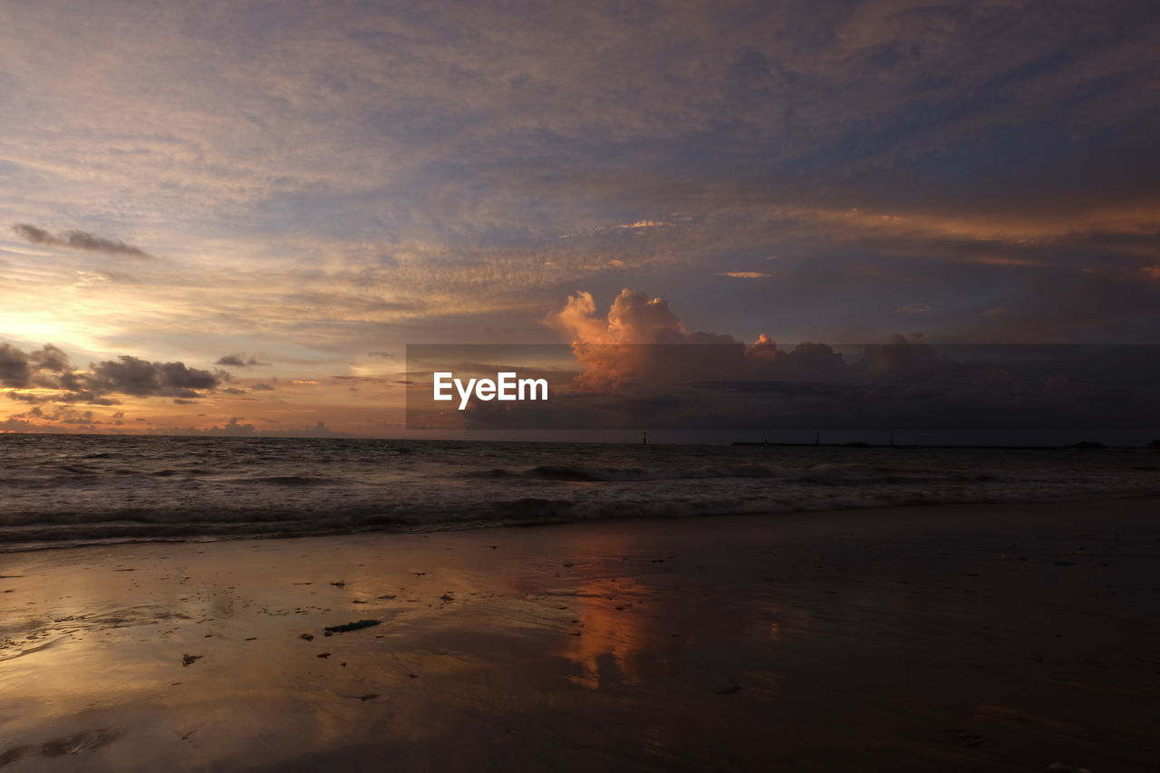 Scenic view of sea against sky at sunset