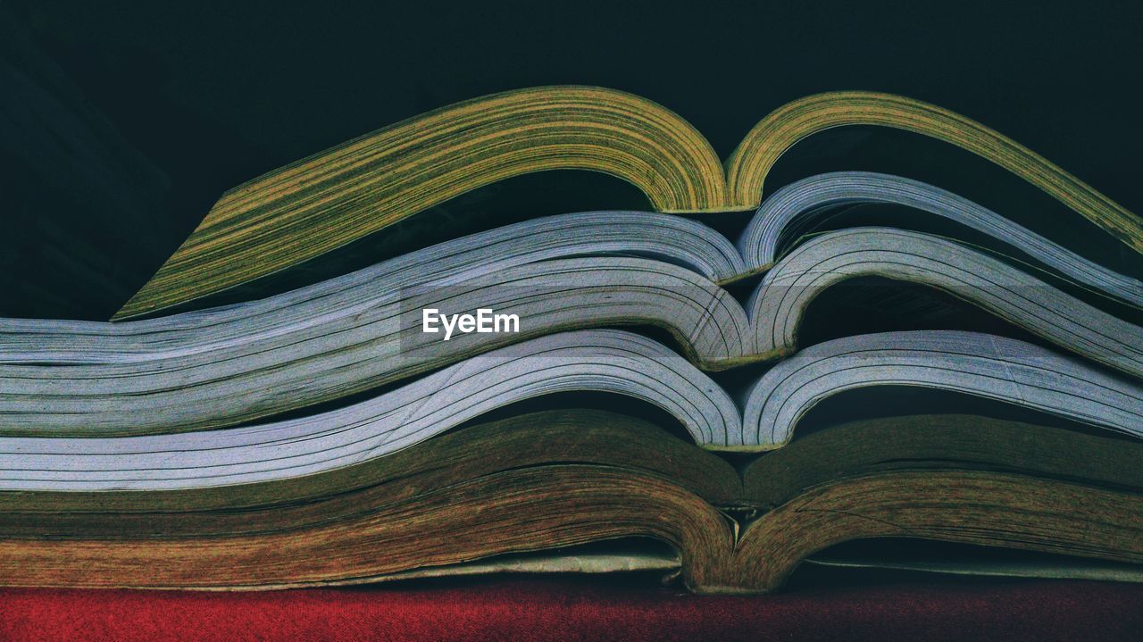 Opened books in aligned stacks