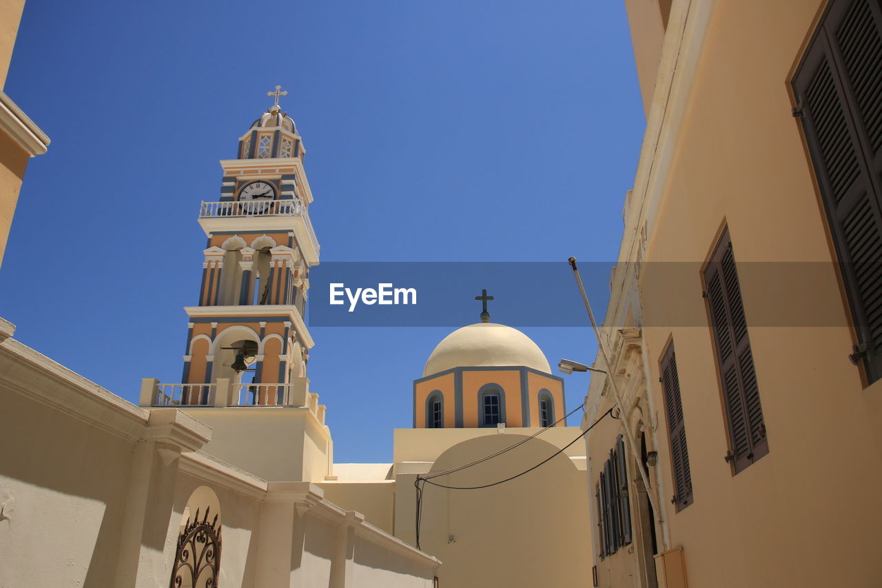 Low angle view of church against sky in santorini island 