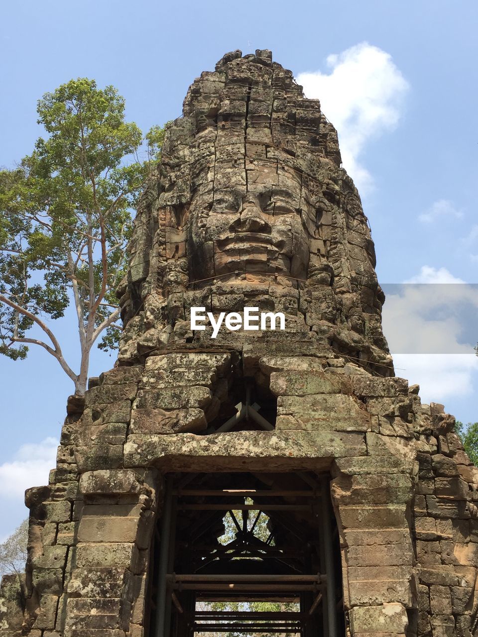 LOW ANGLE VIEW OF BUDDHA STATUE AGAINST SKY