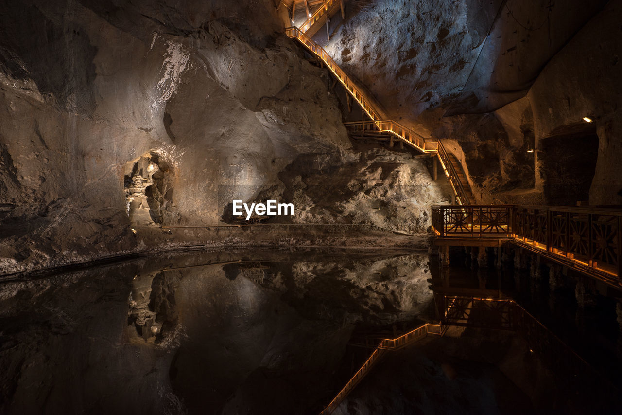 Pond in illuminated cave