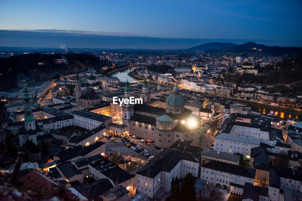 Aerial view of cityscape against sky at dusk