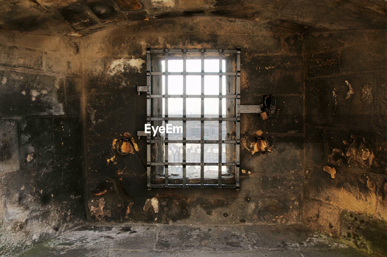 Photo of a window for observation on the wall of edinburgh castle in scotland, england