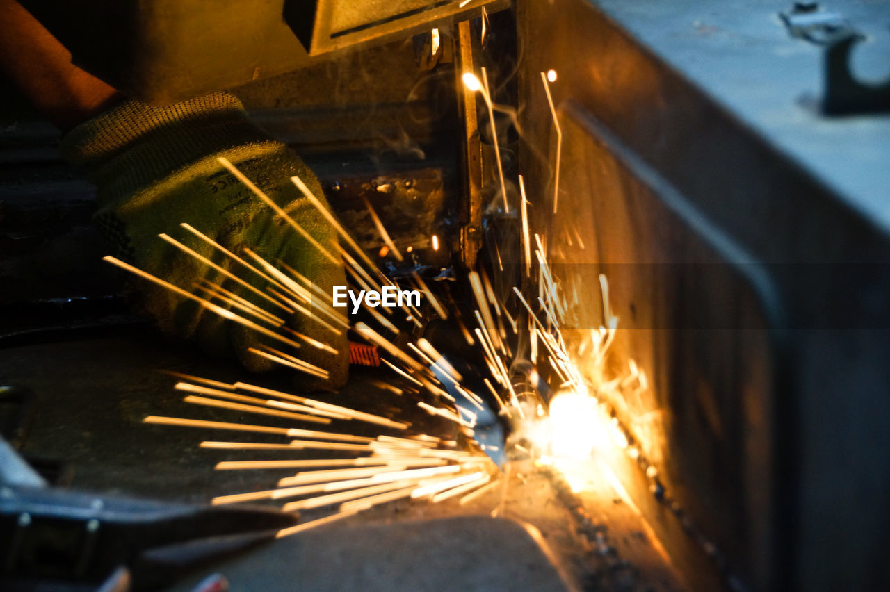 High angle view of man working on metal