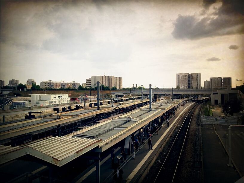 RAILROAD TRACKS ON RAILROAD STATION PLATFORM