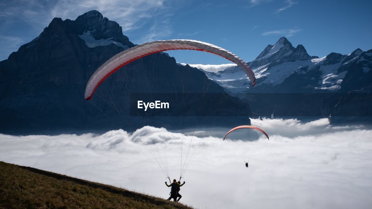 High angle view of people paragliding