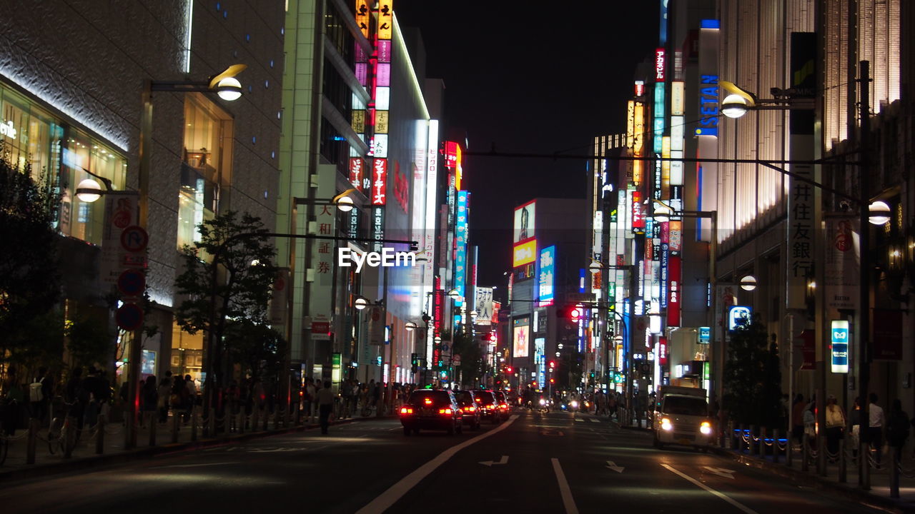 ILLUMINATED CITY STREET AT NIGHT