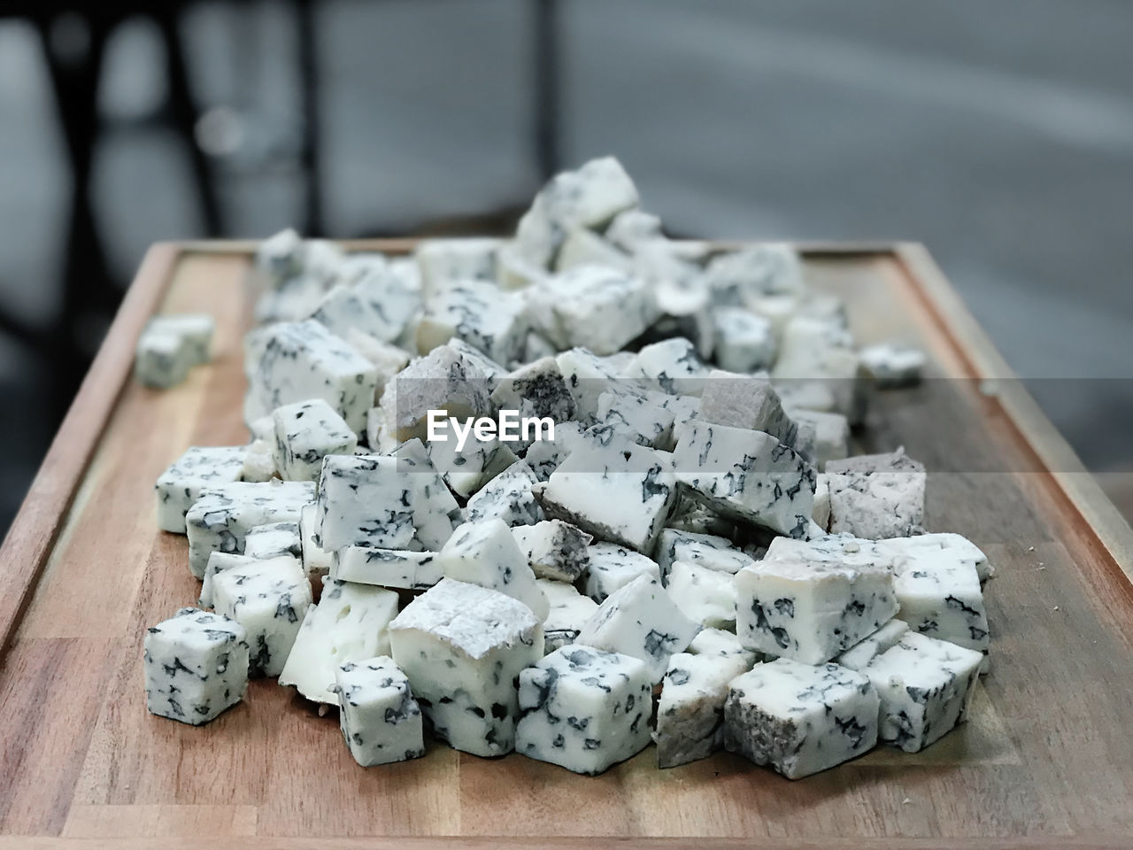 High angle view of cheese on cutting board