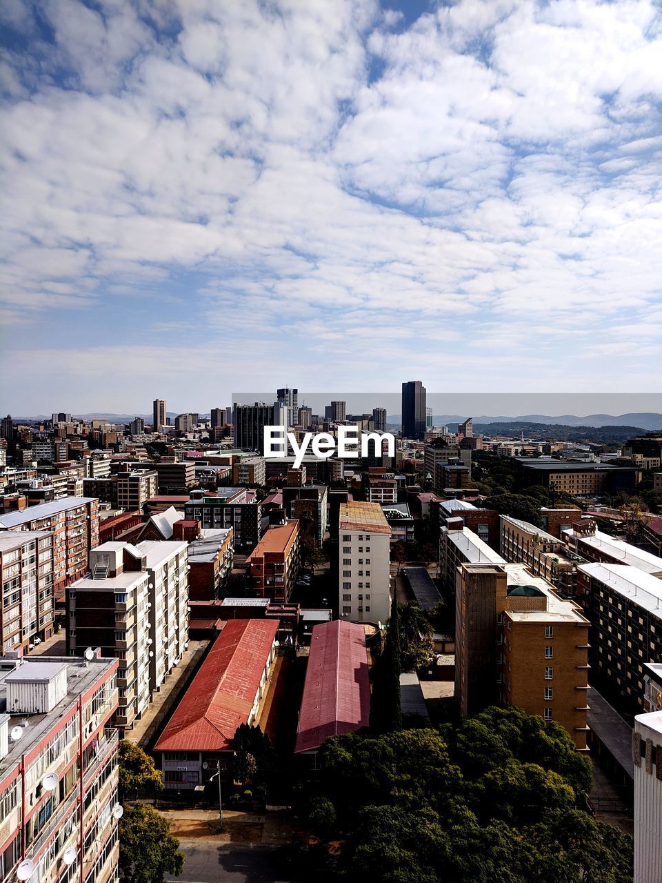 High angle view of buildings in city against sky