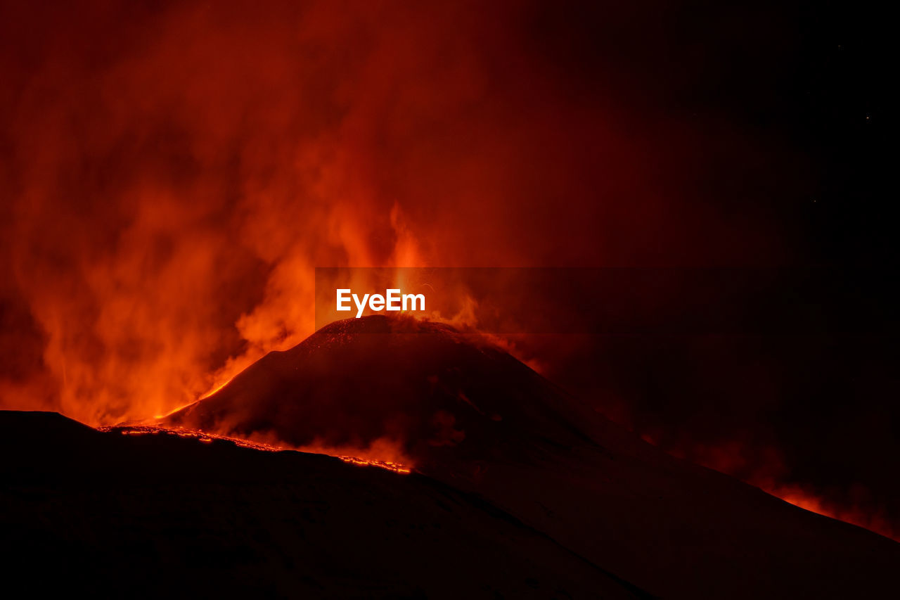 SCENIC VIEW OF VOLCANIC MOUNTAIN DURING SUNSET