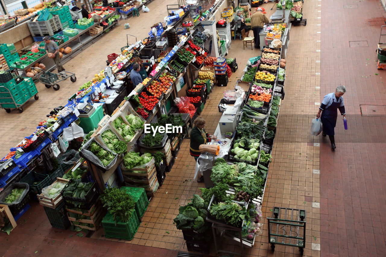 High angle view of people shopping in vegetables and fruits market