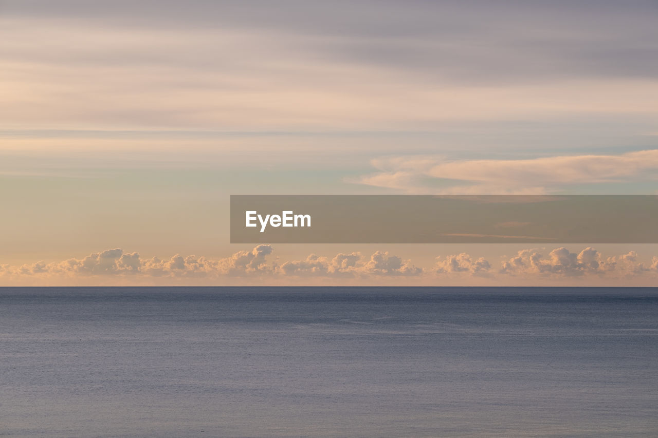 Scenic view of sea against sky during sunrise 