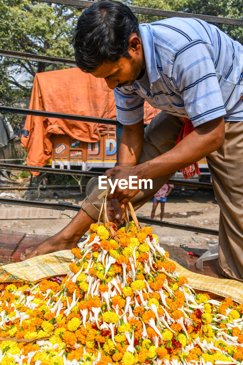 FULL LENGTH OF MAN PREPARING FOOD