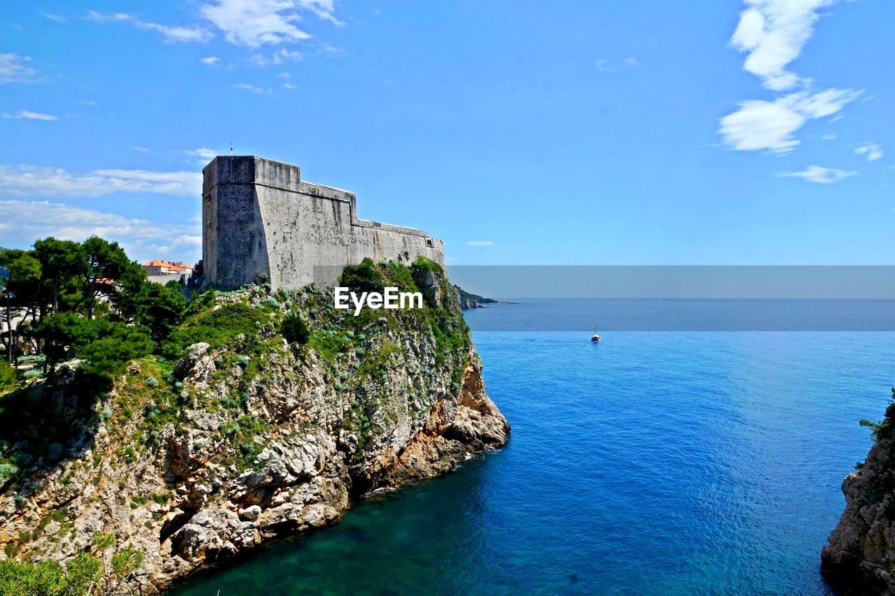 Scenic view of sea against blue sky