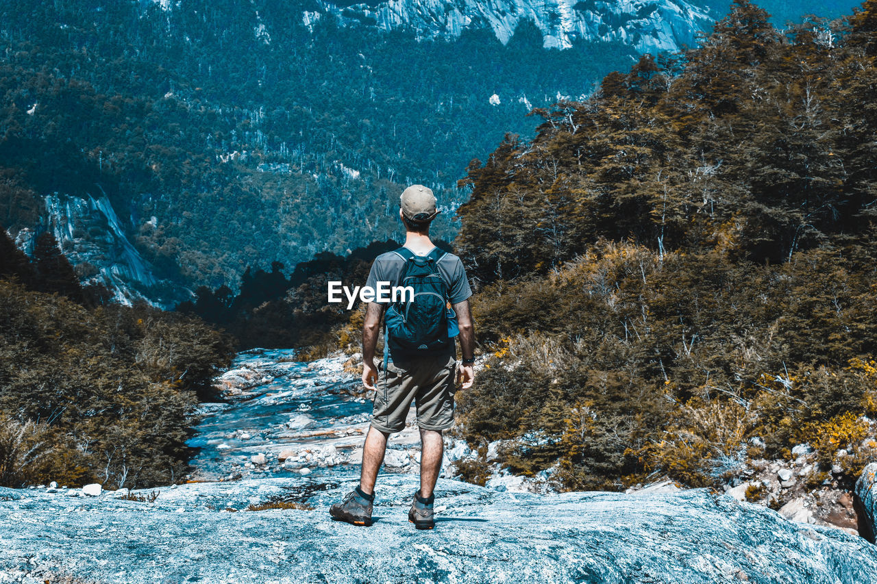 Full length rear view of man walking on mountain