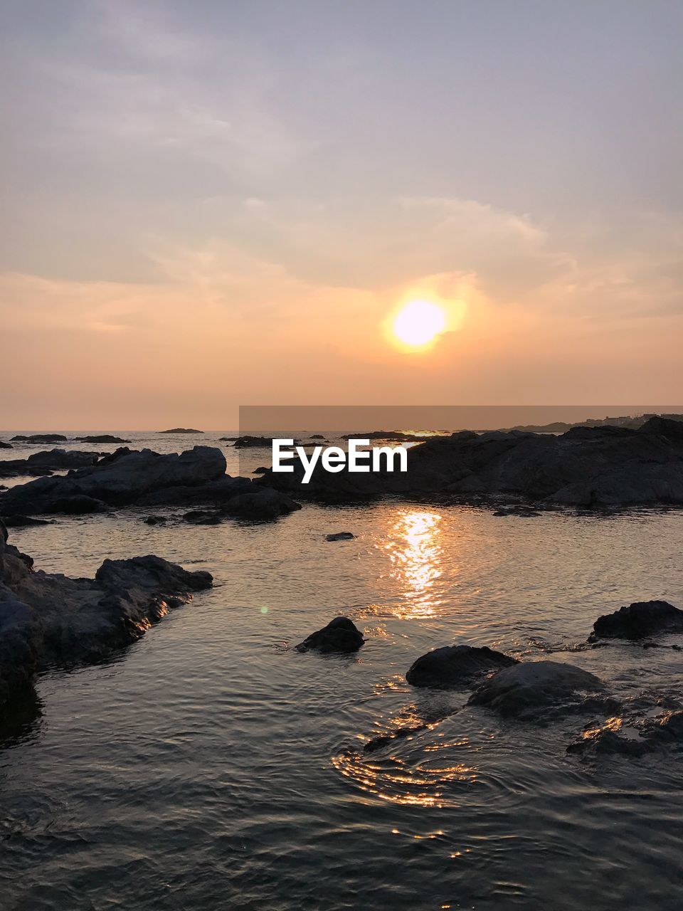 Scenic view of sea against sky during sunset