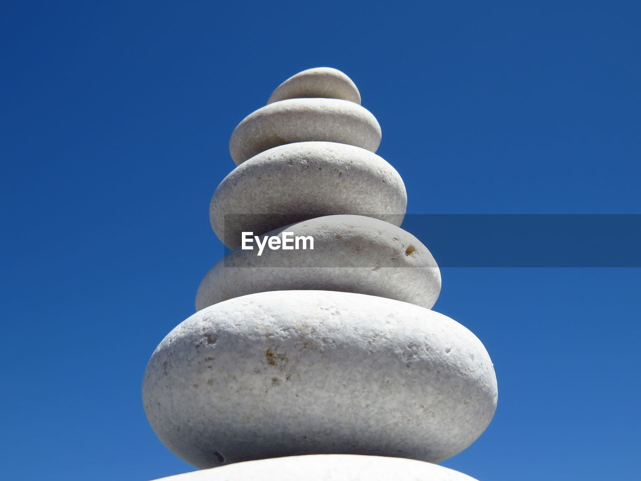 Low angle view of tree against clear blue sky