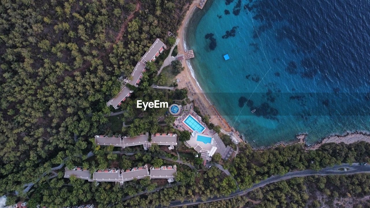 HIGH ANGLE VIEW OF SWIMMING POOL ON BEACH