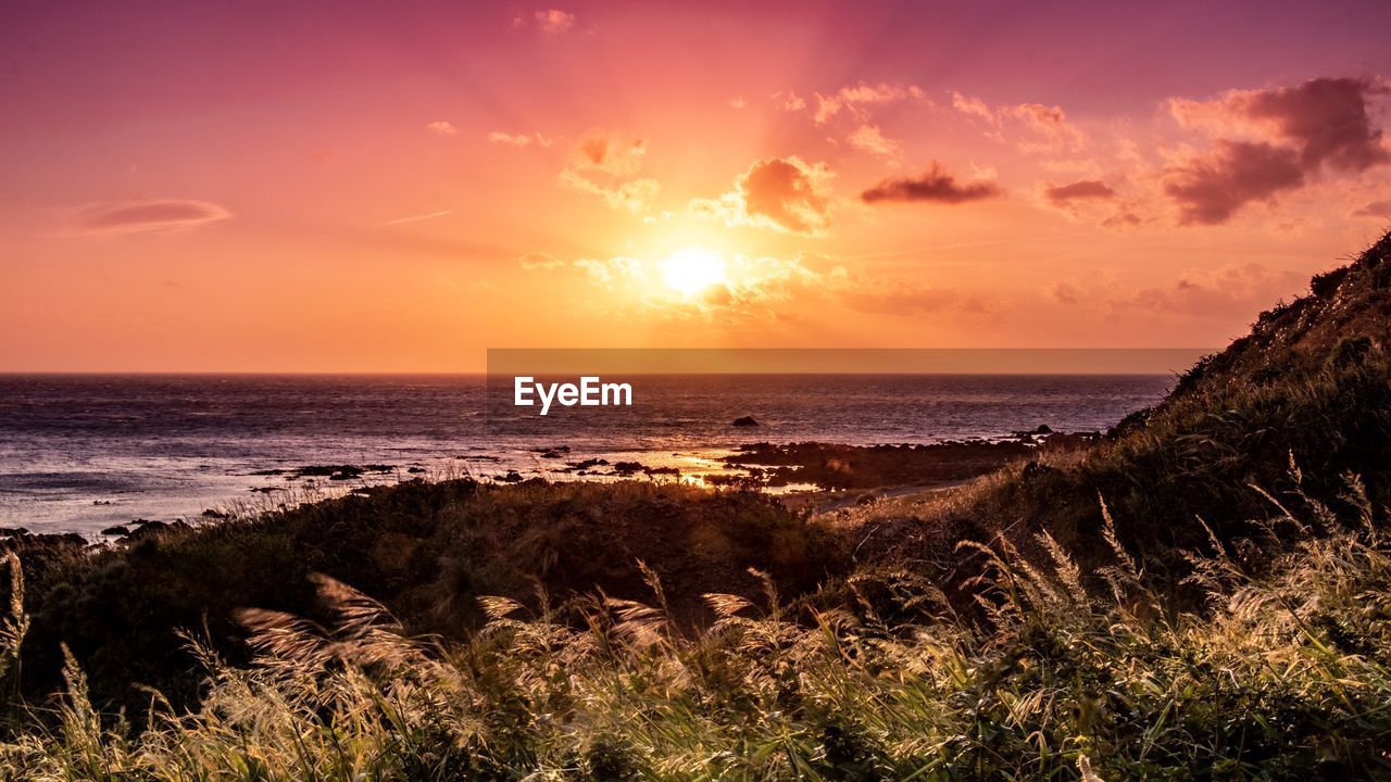 Scenic view of sea against sky during sunset