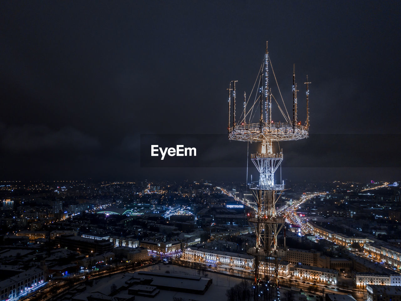 High angle view of illuminated buildings in city at night