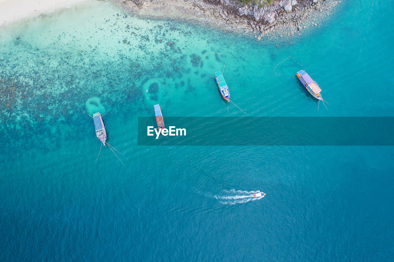 Aerial view of boats moored sea