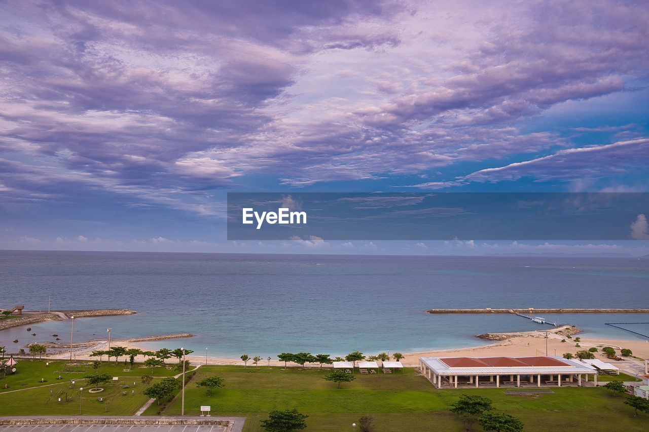 SCENIC VIEW OF SEA BY BUILDINGS AGAINST SKY