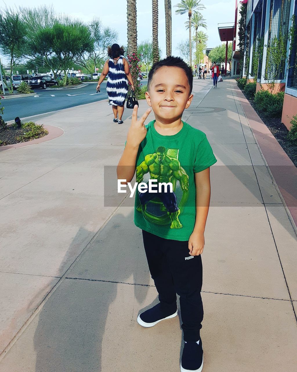 FULL LENGTH PORTRAIT OF BOY ON FOOTPATH