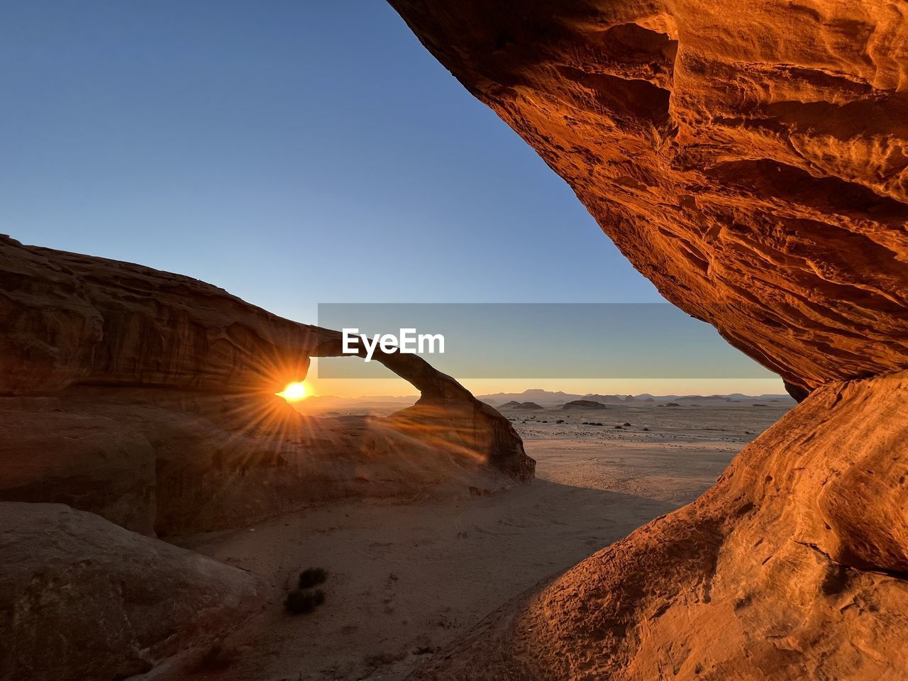 Scenic view of desert against clear sky