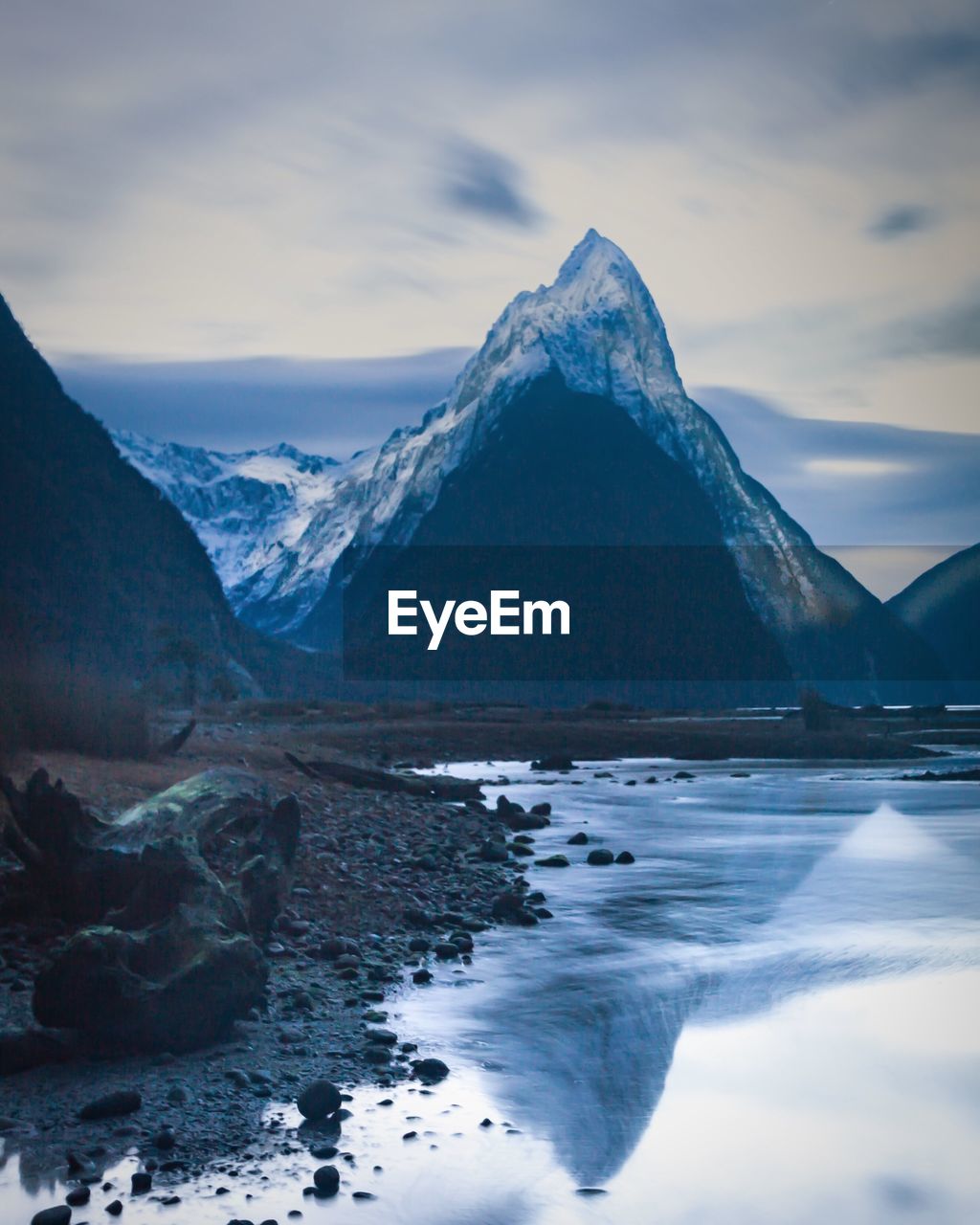 Scenic view of snow covered mountains against sky