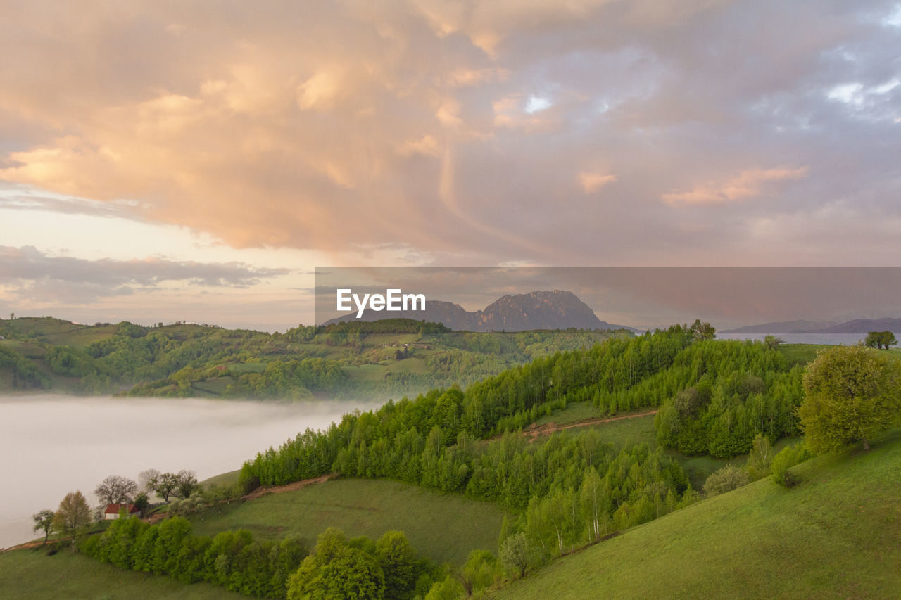 Scenic view of landscape against sky during sunset