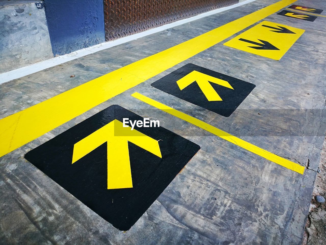 High angle view of arrow signs on road