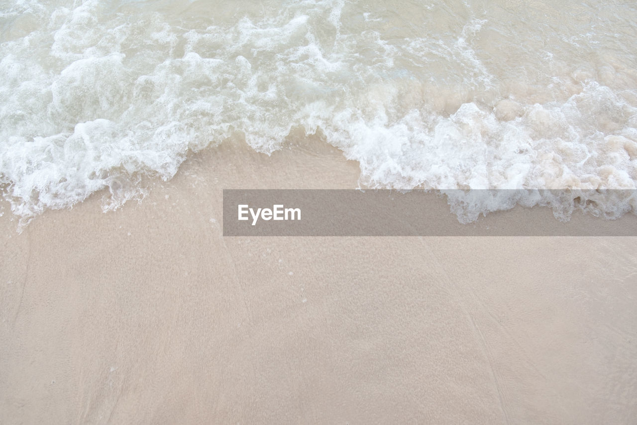 High angle view of surf on beach