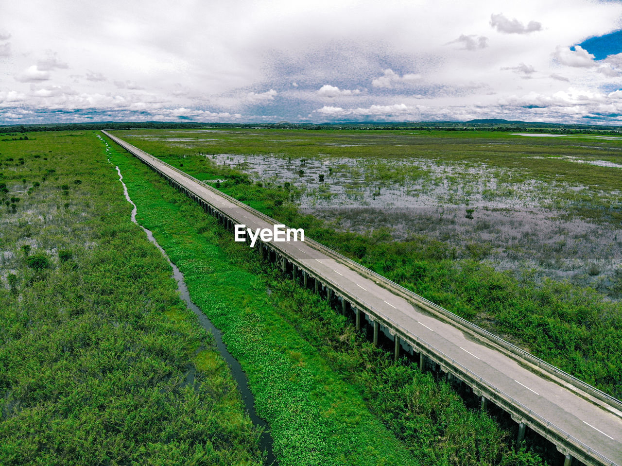 VIEW OF RAILROAD TRACK ON FIELD