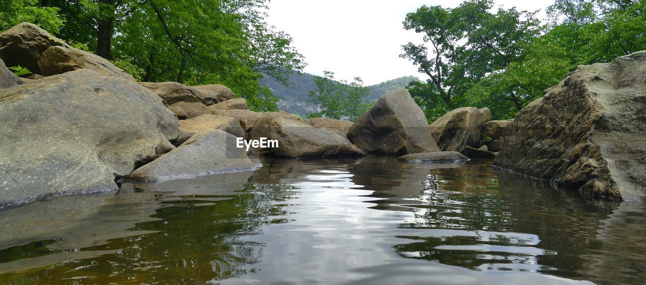 SCENIC VIEW OF ROCK FORMATIONS IN WATER