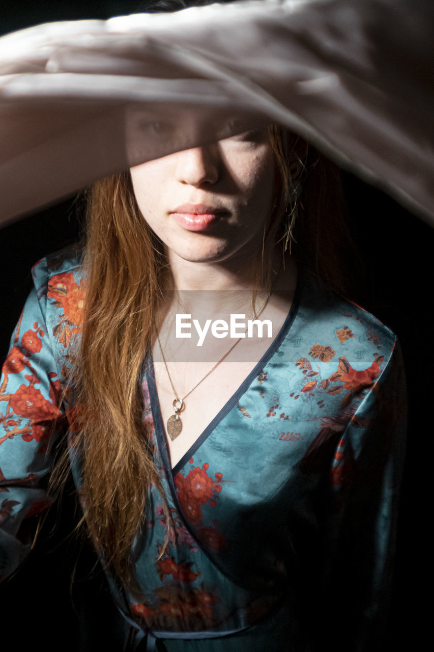 one person, adult, fashion, women, female, young adult, portrait, clothing, long hair, glasses, front view, hairstyle, photo shoot, fashion accessory, person, red, indoors, emotion, headshot, waist up, human face, sadness, blond hair, human hair, spring, make-up, brown hair, casual clothing