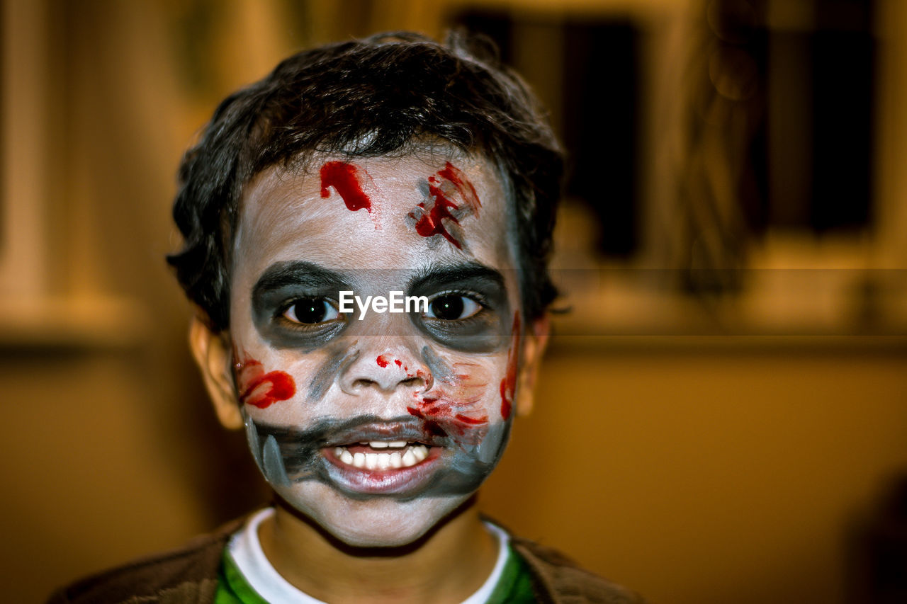 Portrait of boy with halloween makeup
