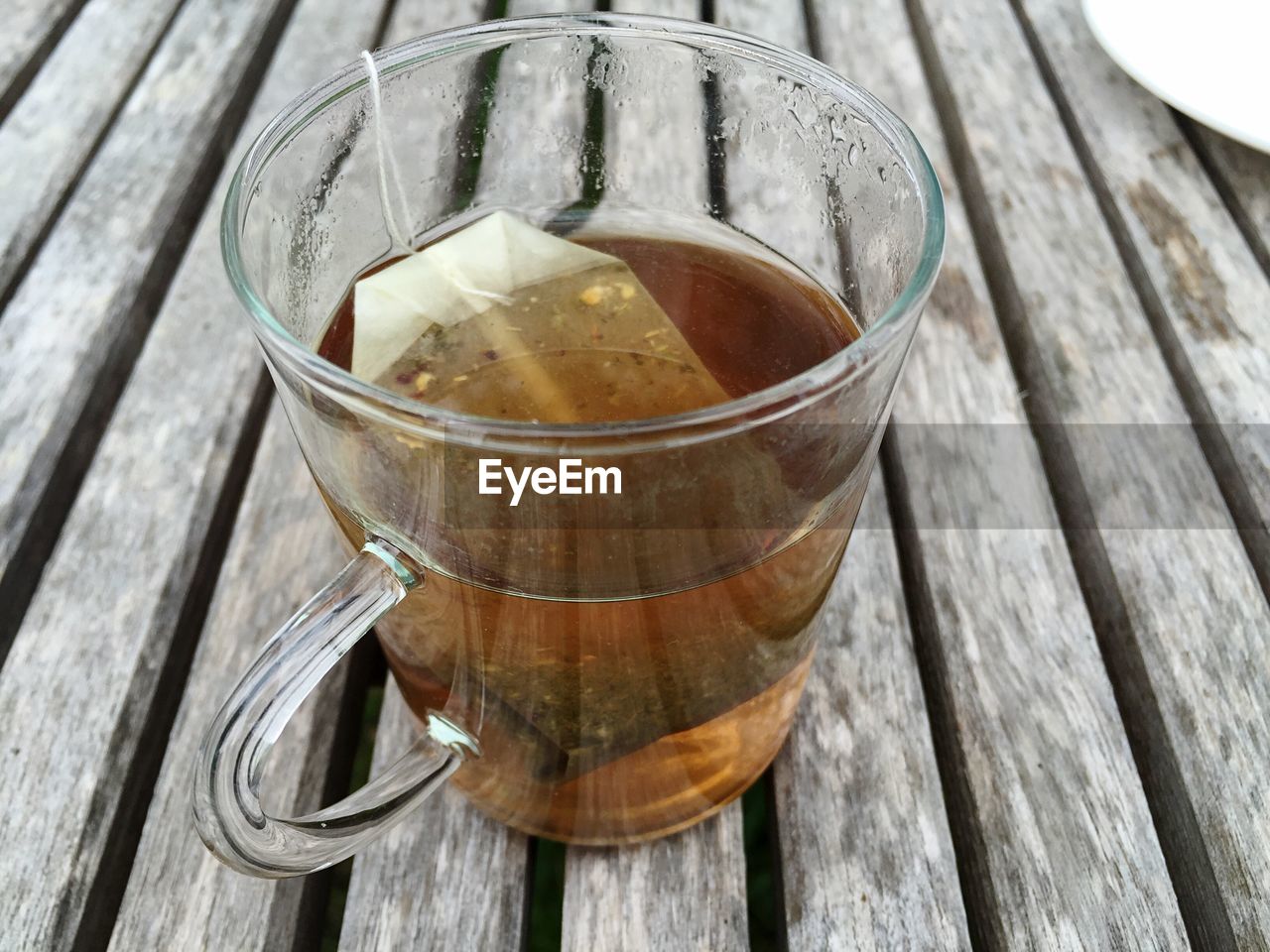 High angle view of herbal tea cup on table