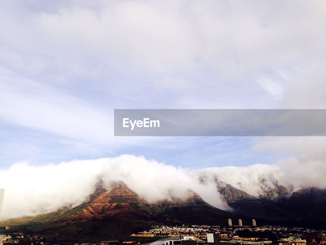 Buildings by mountains