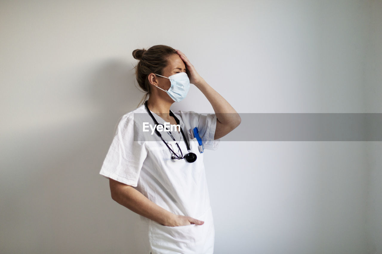 Female doctor wearing protective face mask