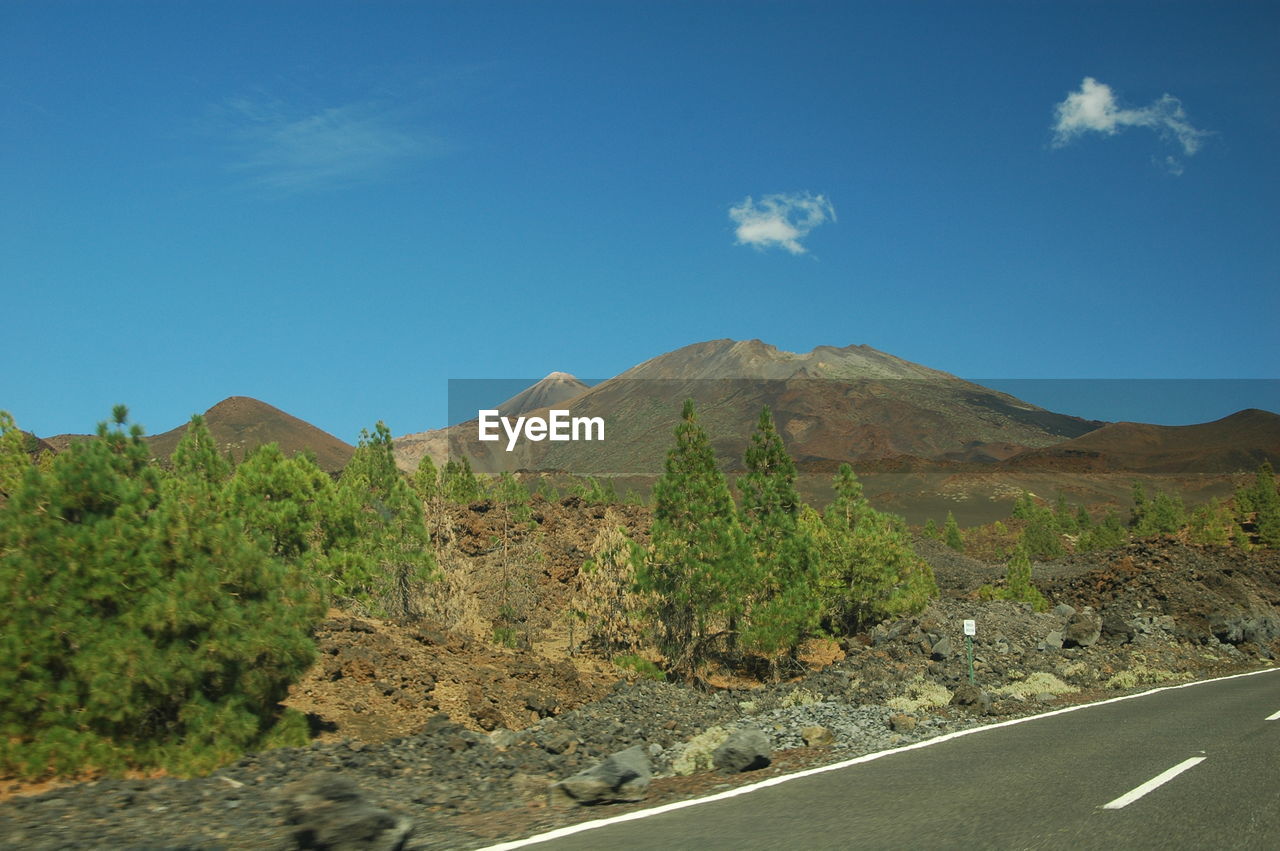 Scenic view of landscape against clear blue sky