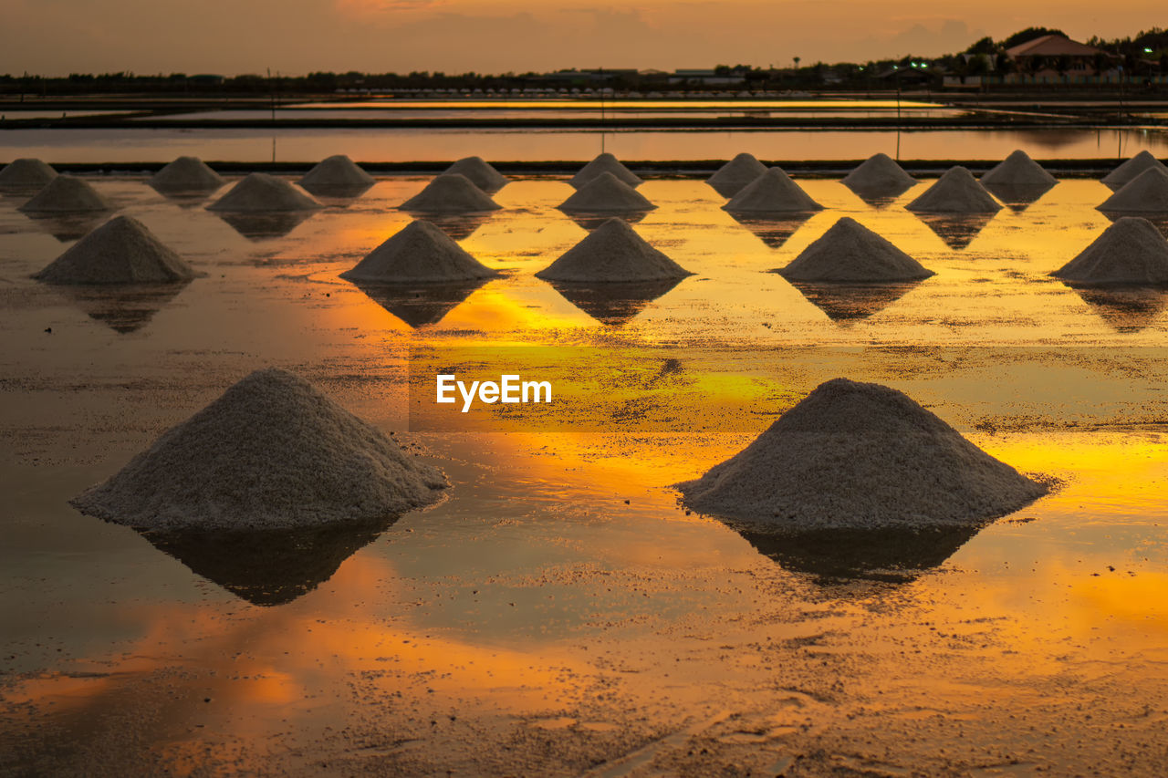 Salt in the salt fields in the evening during the shoveling of salt 