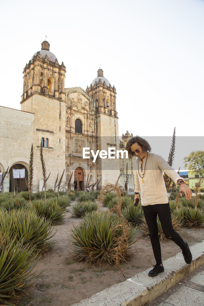 Mexican man chilling outside santo domingo church in oaxaca